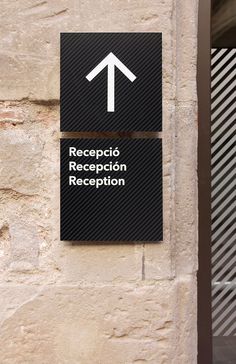 a sign on the side of a building that says receptio reception and reception