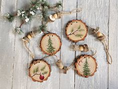 christmas ornaments made out of wood with pine trees on them