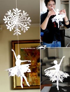 paper snowflakes are hanging from strings in the shape of ballerinas