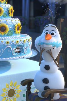 there is a frosted cake with sunflowers on it and a frozen queen figure next to it