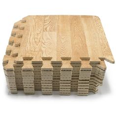 a wooden table topped with lots of square pieces of wood sitting on top of each other