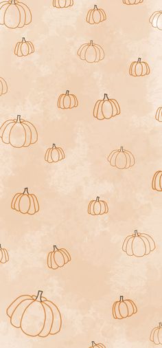 an orange and white background with pumpkins on the side, all in different sizes