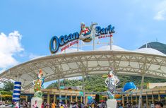 the entrance to an amusement park with lots of people