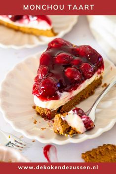 a piece of cheesecake with cherries on top is sitting on a white plate