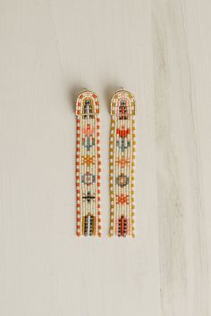 pair of beaded earrings on white background