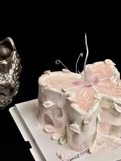 there is a cake that looks like a butterfly on it