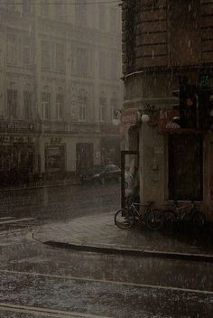 a person walking down a street in the rain