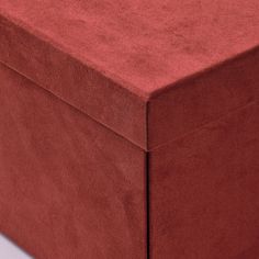 a large red box sitting on top of a white table