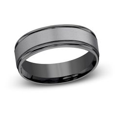 a men's wedding band with a satin finish and black ceramic in the center