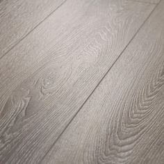 an image of wood flooring that looks like it has been painted grey and white