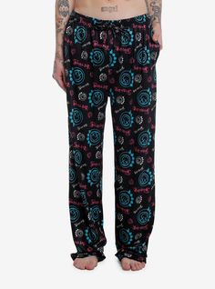 Unwind from the Blink-182 show in these Blink-182 pajama pants! They're black with a white  turquoise and pink allover print of the band's text logo and smile face logo. Drawstring  elasticated waistband and pockets.95% polyester; 5% spandexWash cold; dry lowImportedListed in unisex sizesModel is 6'1"Model wears size Medium Blink 182 Logo, Turquoise And Pink, Emily The Strange, Blue Beetle, Face Logo, Blink 182, White Turquoise, Text Logo, Print Pajamas