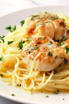 pasta with shrimp and parsley on white plate