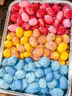 a tray filled with lots of different colored candies