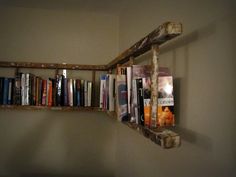 an old wooden shelf with books on it