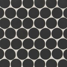 a black and white polka dot tile pattern