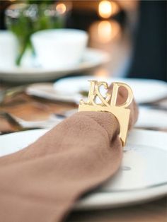 a close up of a table with plates and napkins