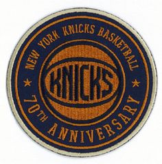 an orange and blue patch with the words new york knicks basketball on it