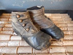 A rare find!  A pair of late 18th century child's shoes/boots from the Victorian era!  These 4 button boots are hand made from brown leather and measure 5 3/4" long. They stand approximately 3" high. Wonderful for your collection of historical clothing.  They were obviously well loved and used and show wear and tear.  Enlarge your screen to get a good look at the details and character of this charming pair.  Feel free to message me with any questions. Vintage Leather Booties, Antique Leather Sole Boots With Round Toe, Victorian Shoes Women, Victorian Shoes, Button Boots, Children Shoes, Shoes Brown, Historical Clothing, Victorian Era