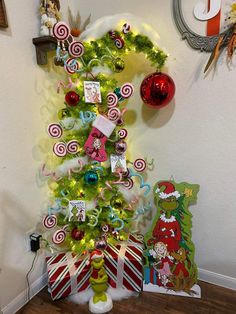 a christmas tree decorated with candy canes and ornaments