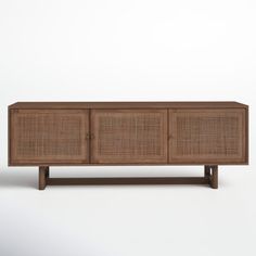 the sideboard is made out of wood and wicker