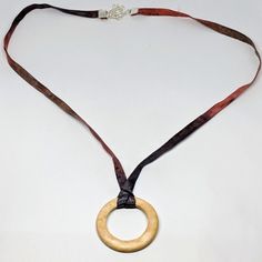 This Handmade Necklace Features A Ring Of Coconut Wood. It Is Hung On A Silk Cord Made From Dyed Recycled Saris. The Necklace Is 20-22" Long With A Lobster Clasp. One Of A Kind And Brand New Without Tags. Coconut Wood, Silk Necklace, Necklace Wood, Wood Ring, Brooch Necklace, Wood Rings, Coin Pendant, Love Necklace, Handmade Necklace