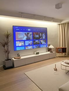 a flat screen tv mounted on the wall in a living room