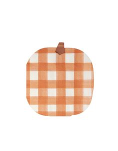 an orange and white checkered pumpkin with a brown leather tag on the front, against a white background