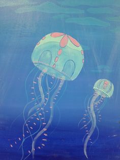 two jellyfish swimming in the ocean together