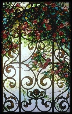 a stained glass window with roses on it