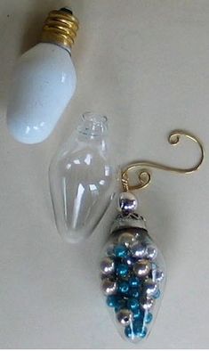 a light bulb and some glass beads on a table