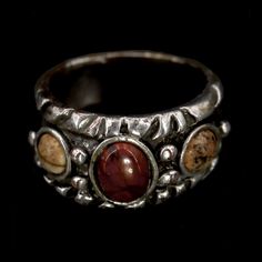 Vintage Hopi Red Jasper & Tan/Black Silver Lace Jasper Sterling Silver Band No Markings Tested As Sterling Silver Verified Red Jasper Verified Silver Lace Jasper (Tan/Black) Total Weight ~ 9.4 Grams Band Width ~ 7 - 12mm (1) Red Jasper ~ 9 X 7 X 2mm (2) Silver Lace Jasper ~ 6 X 6 X 1.5mm Size 7 3/4 Us Made In The Usa Handmade Hand Tooled Aboriginal Native American Indigenous Collectible Investment Wearable Art #3078 Silver Lace, Red Jasper, Sterling Silver Bands, Womens Jewelry Rings, Silver Band, Wearable Art, Black Silver, Native American, Vintage Ladies