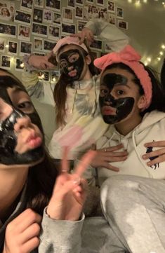 several people with face masks posing for the camera