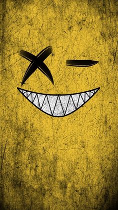 a smiley face drawn in black and yellow on a grungy background with scissors