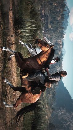 three people riding horses in the middle of a mountain range with trees and mountains behind them