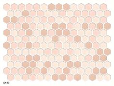 a white and pink tile pattern with hexagonal shapes