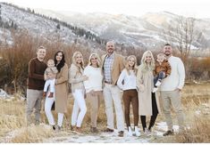 a family posing for a photo in the snow