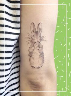 a small mouse tattoo on the right side of the arm, with an image of a little