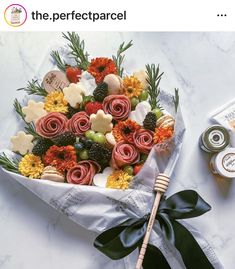 a bouquet of flowers and cookies on a table