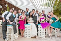 a group of people that are posing for a picture together in front of some chairs