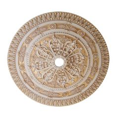 an intricately designed circular bowl with decorative designs on the side and center piece in gold