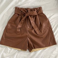 Never Been Worn! New Leather Shorts, Super Cute. Shell: 100% Polyester, Coating: 100% Polyurethane Zipper, Button And Tie Brown Paperbag Waist Bottoms For Work, Brown Faux Leather Bottoms With Belt Loops, Brown Faux Leather Bottoms For Spring, Brown Leather Short Bottoms, Elegant Faux Leather Bottoms For Summer, Elegant Faux Leather Summer Bottoms, Elegant Faux Leather Bottoms For Day Out, Brown High Waist Shorts With Belt Loops, High Waist Brown Shorts With Belt Loops