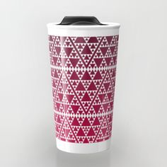 a blue and white travel mug with triangles on it