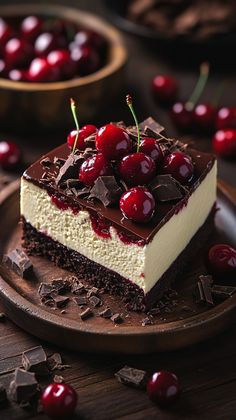 a piece of cake with chocolate and cherries on top