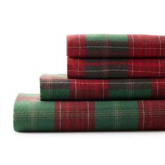 three plaid sheets are stacked on top of each other in red, green and black