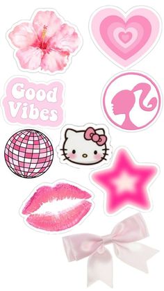 some stickers that are on the side of a white wall with pink and red decorations