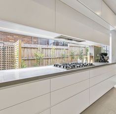 a kitchen with an oven, stove and counter top in it's center island