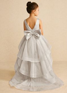 We encourage all our flower girls to feel like the princess they are while wearing Pumpkin. Made from matte satin and tulle, she features a scoop neckline, a bow tie belt, a ruched A-line silhouette, and a tiered tulle skirt trimmed with horsehair. Frost Flower, Tiered Tulle Skirt, Pumpkin Flower, Tulle Flower Girl, Flower Girl Dresses Tulle, Matte Satin, Flower Girls, Horse Hair, Girl Dresses