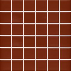 a brown and white tiled wall with squares