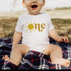 Celebrate your little one's first trip around the sun in style with our Sun in One 1st Birthday Bodysuit! Perfect for a sunshine theme first birthday, you can complete the look with matching tees for the whole family! And with its 100% combed ringspun cotton and light fabric, it’ll feel almost like baby’s been wearing it forever! (Almost as long as they’ve been around the sun!) Fitted Bodysuit For First Birthday In Summer, Fitted Summer Onesie For Birthday, Fitted Onesie For Summer Birthday, Fun Summer Birthday Onesie, Sun Onesie, Sunshine Theme, Birthday Bodysuit, Birthday Onesie, Orange Shorts