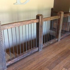 two wooden baby gates sitting on top of a hard wood floor